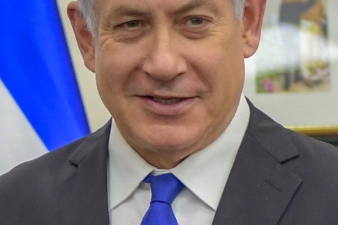 A person in a suit and tie Description automatically generated with medium confidence